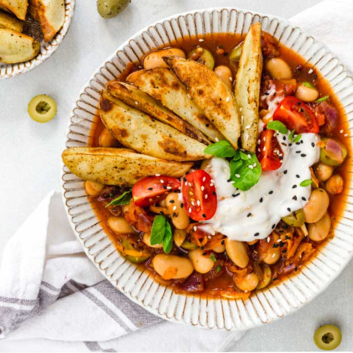 Recipe | Mediterranean Olive & Butterbean Stew with Crispy Wedges by Nourishing Amy & Olly's